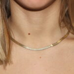 Collana in argento placcato oro piattina con fantasia